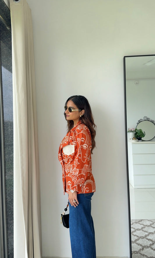 Abstract Faces Orange Shirt