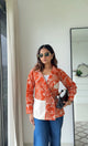 Abstract Faces Orange Shirt